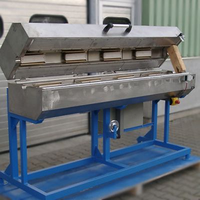 Transition Ovens with tubular heating elements in half-shell construction, which can be opened completely in half by means of a counterweight
