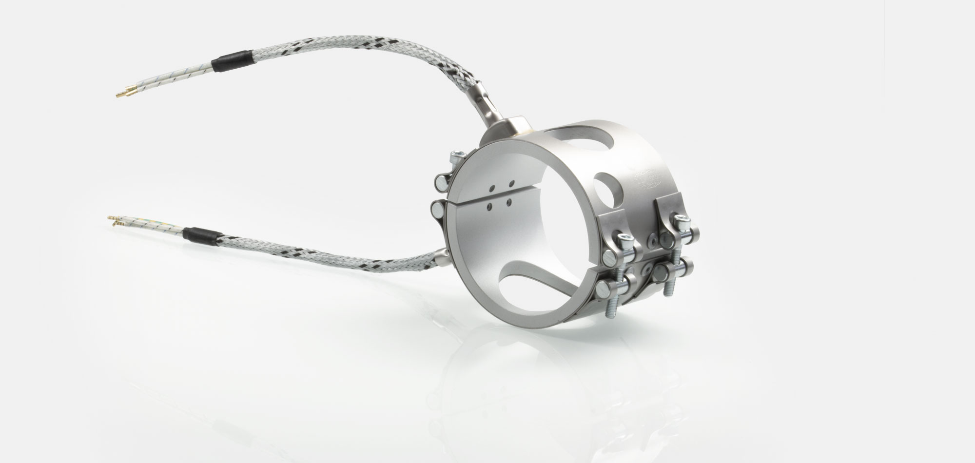 Nozzle Band Heater, for operating temperatures up to 450°C/550°C, injection molding, energy-efficient design, homogeneous heat flow, holes, cutouts, thermocouple connector, integrated thermocouple, special contour, tight installation space,cable extrusion
