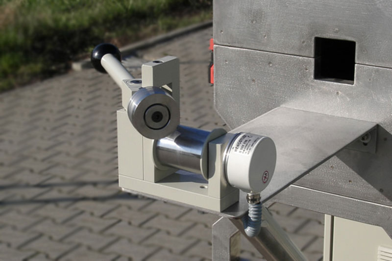 Transition Oven made of stainless steel with a switch box underneath and a hinged upper part for heating an endless steel belt