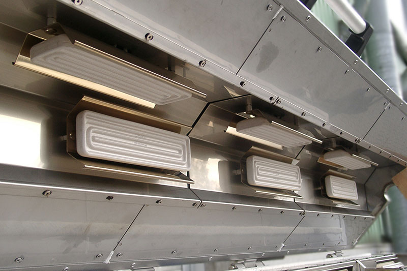 Transition Ovens with tubular heating elements in half-shell construction, which can be opened completely in half by means of a counterweight